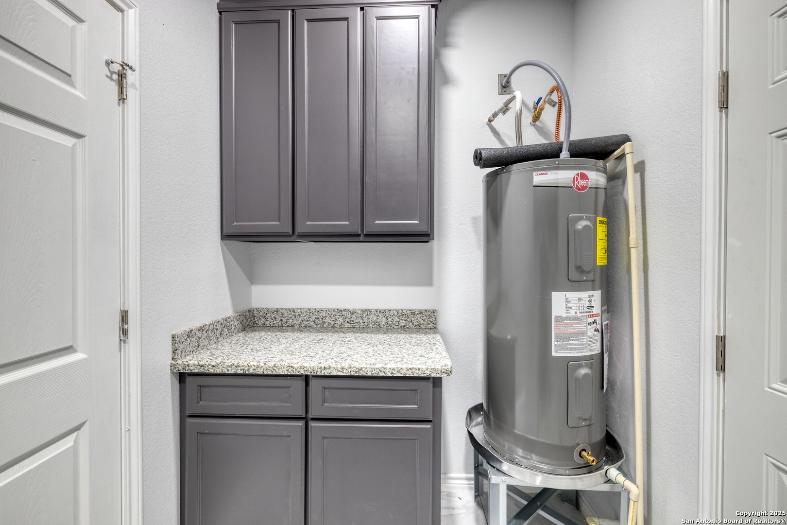 44 Sunday Court Uvalde, TX 78801 - Photo 10 of 30 a kitchen with a refrigerator and cabinets