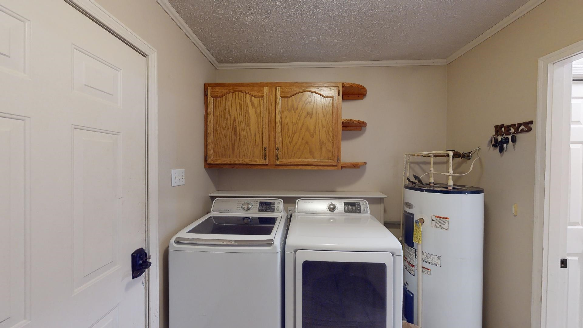 4395 Hamer Road Newbern, TN 38059 - Photo 15 of 20 a utility room with dryer and washer