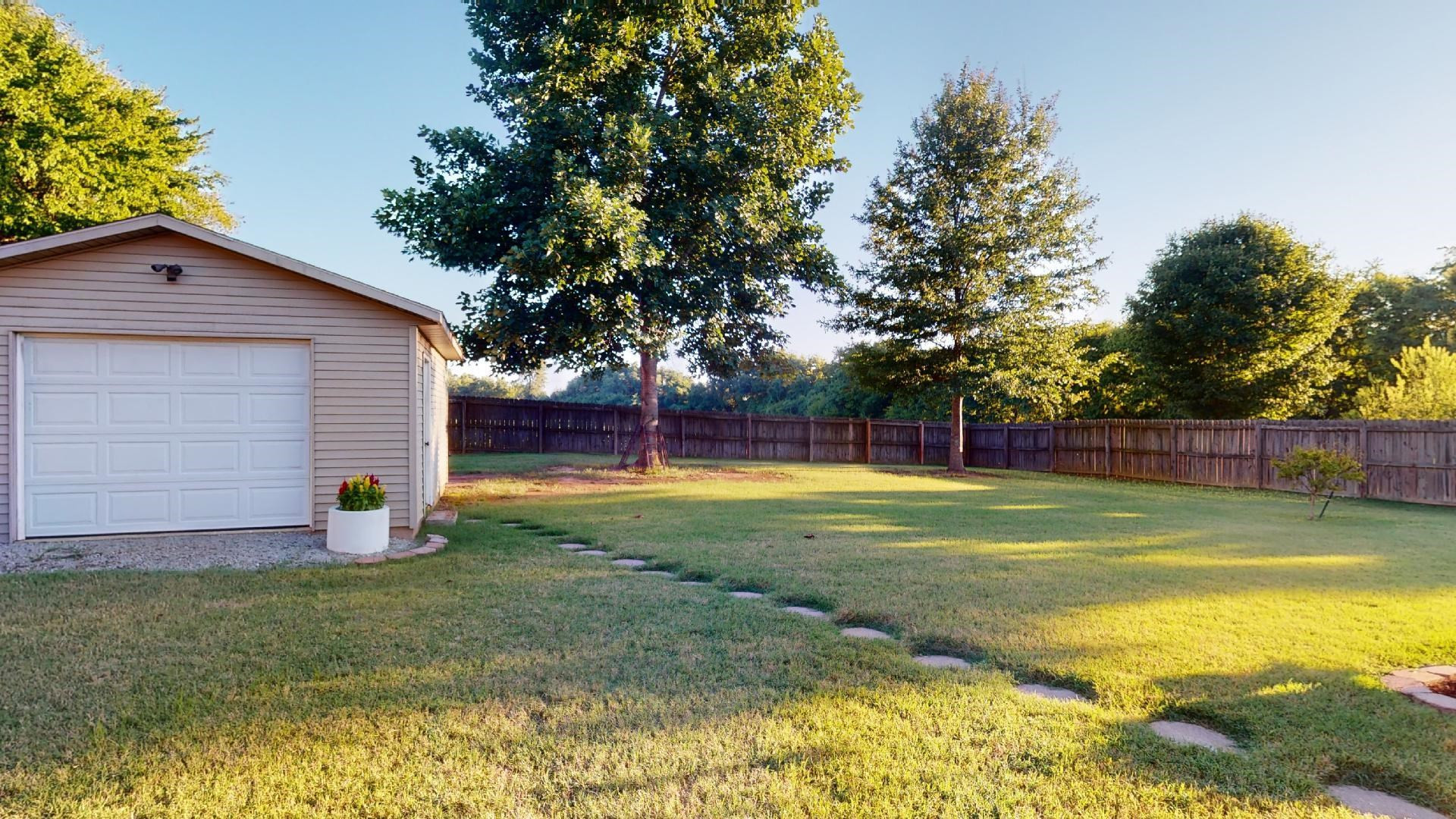 4395 Hamer Road Newbern, TN 38059 - Photo 19 of 20 a view of a backyard with large trees