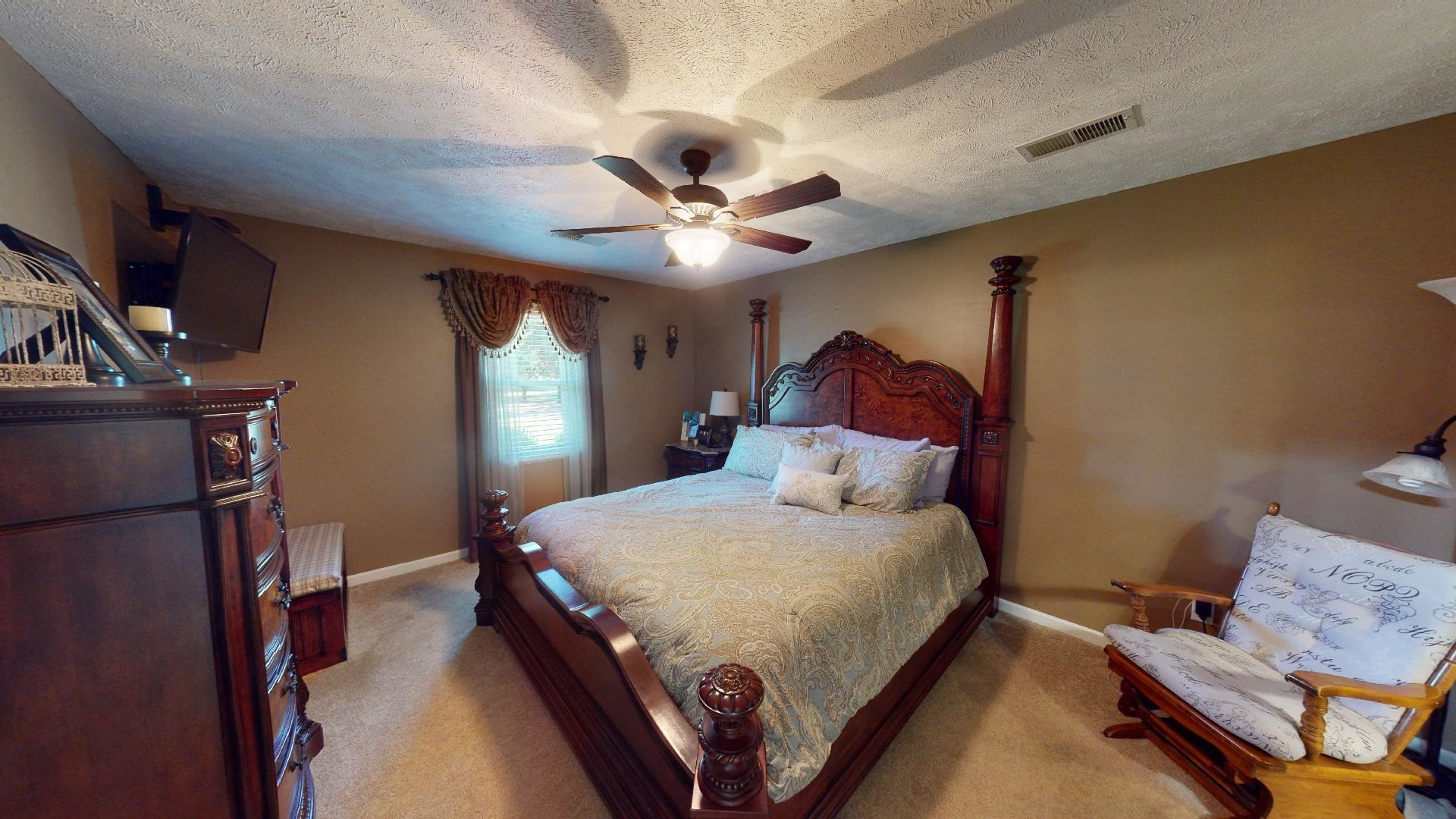 4395 Hamer Road Newbern, TN 38059 - Photo 4 of 20 a bedroom with a bed window and a ceiling fan