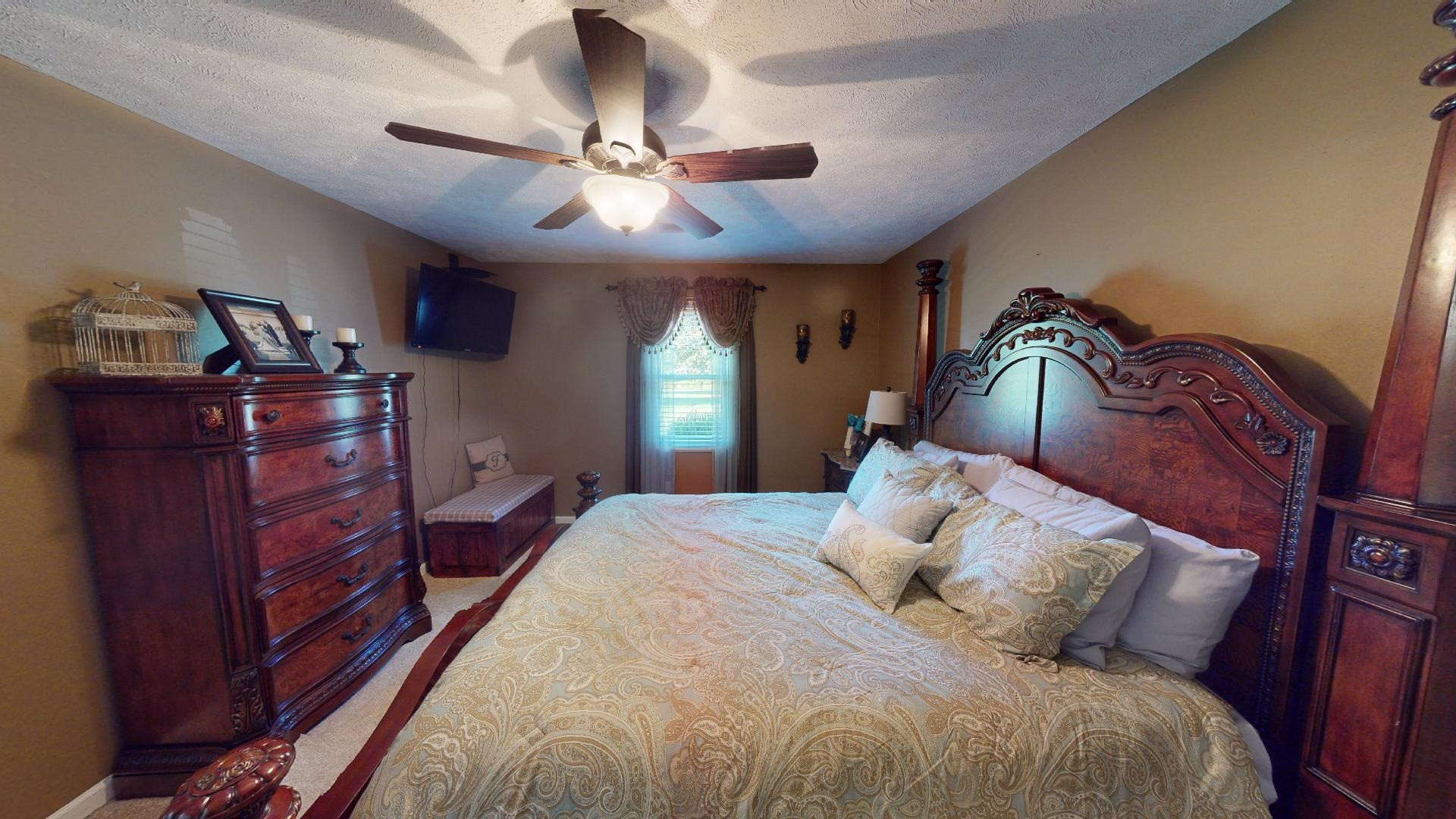 4395 Hamer Road Newbern, TN 38059 - Photo 5 of 20 a bedroom with a bed and wooden floors