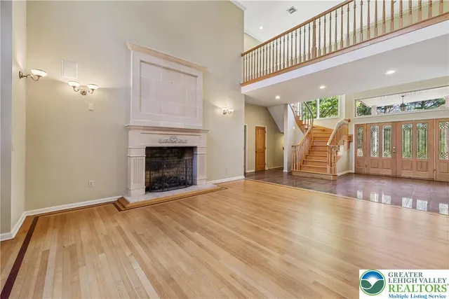 a view of an entryway with wooden floor