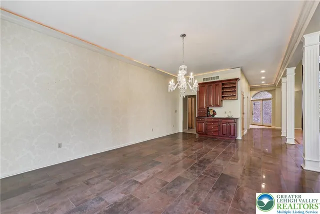 a kitchen with stainless steel appliances kitchen island granite countertop a sink and cabinets