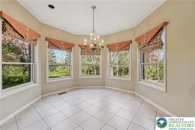 a view of an entryway with a chandelier