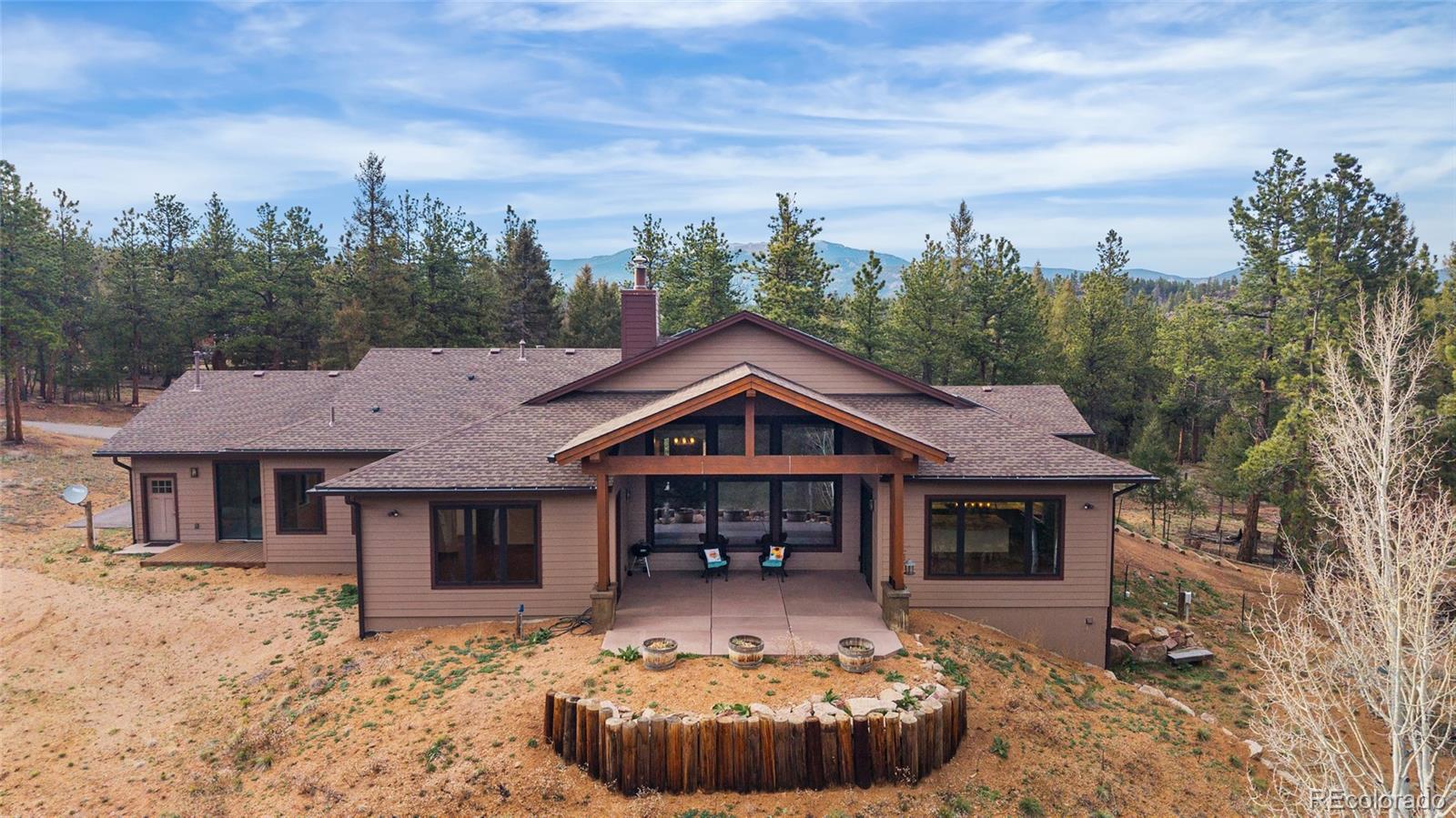 280 Double Tree Road Bailey, CO 80421 - Photo 3 of 43 a front view of a house with garden