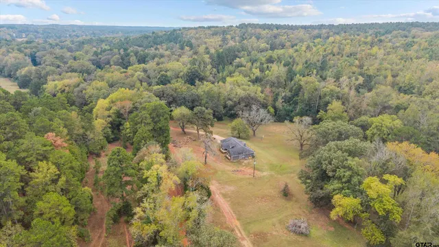 a picture of a bathroom with a refrigerator