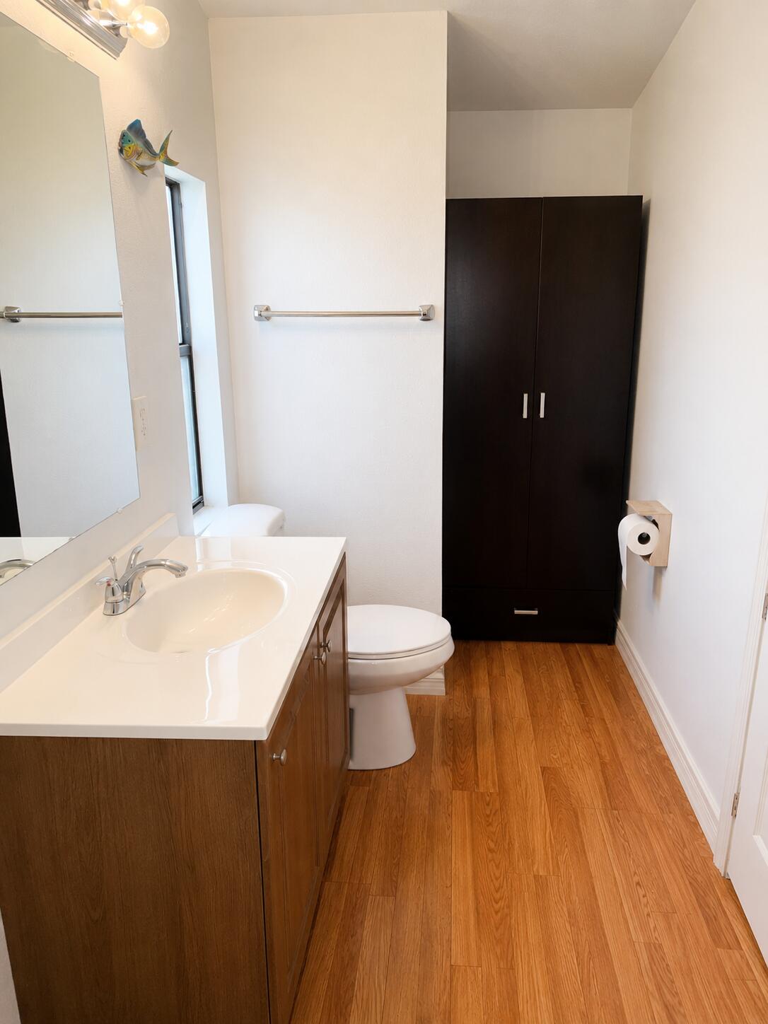 2547 Chatham Way Northeast Palm Bay, FL 32905 - Photo 13 of 24 a bathroom with a sink and a mirror
