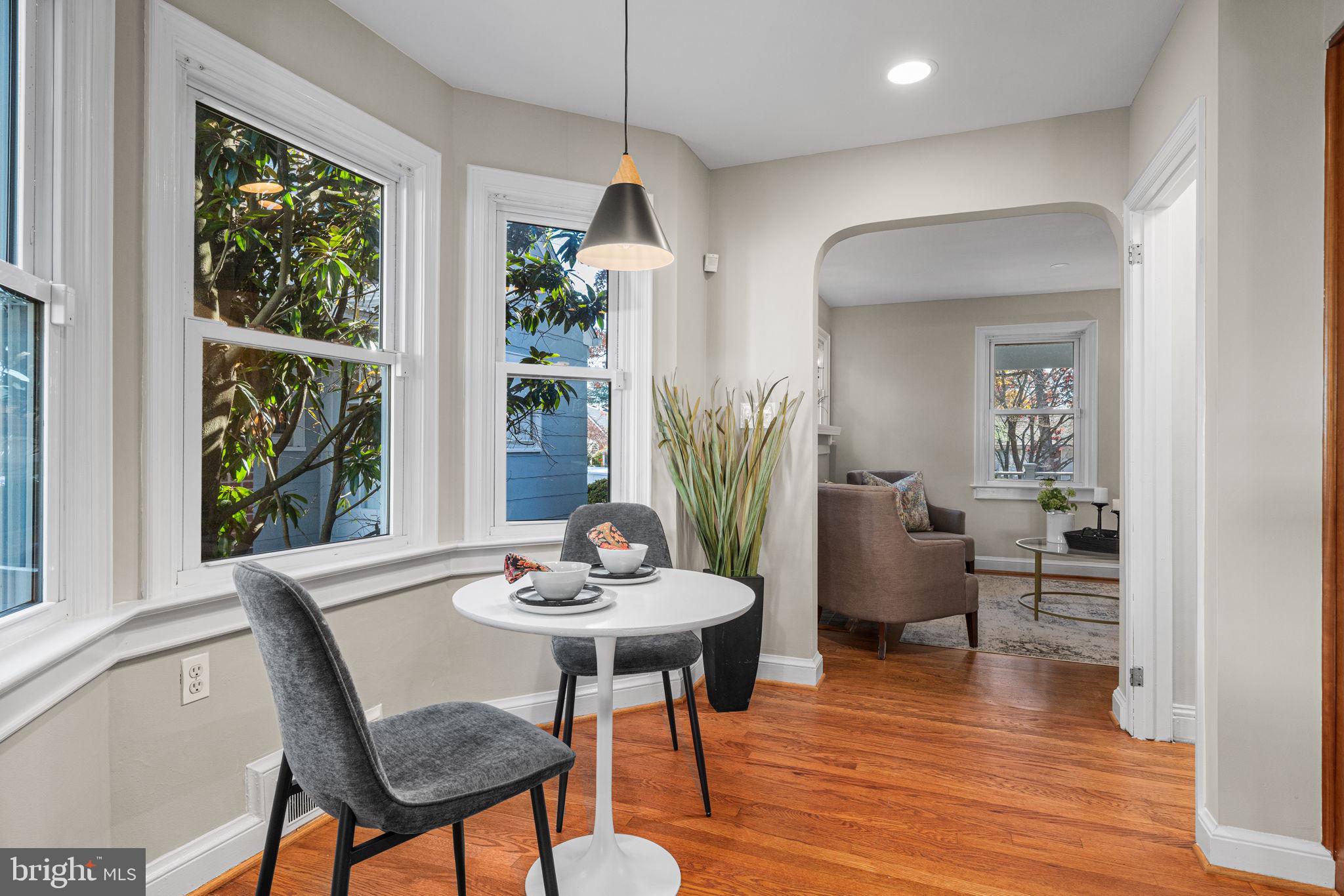 4613 8th Road South Arlington, VA 22204 - Photo 13 of 59 a view of a dining room with furniture window and wooden floor
