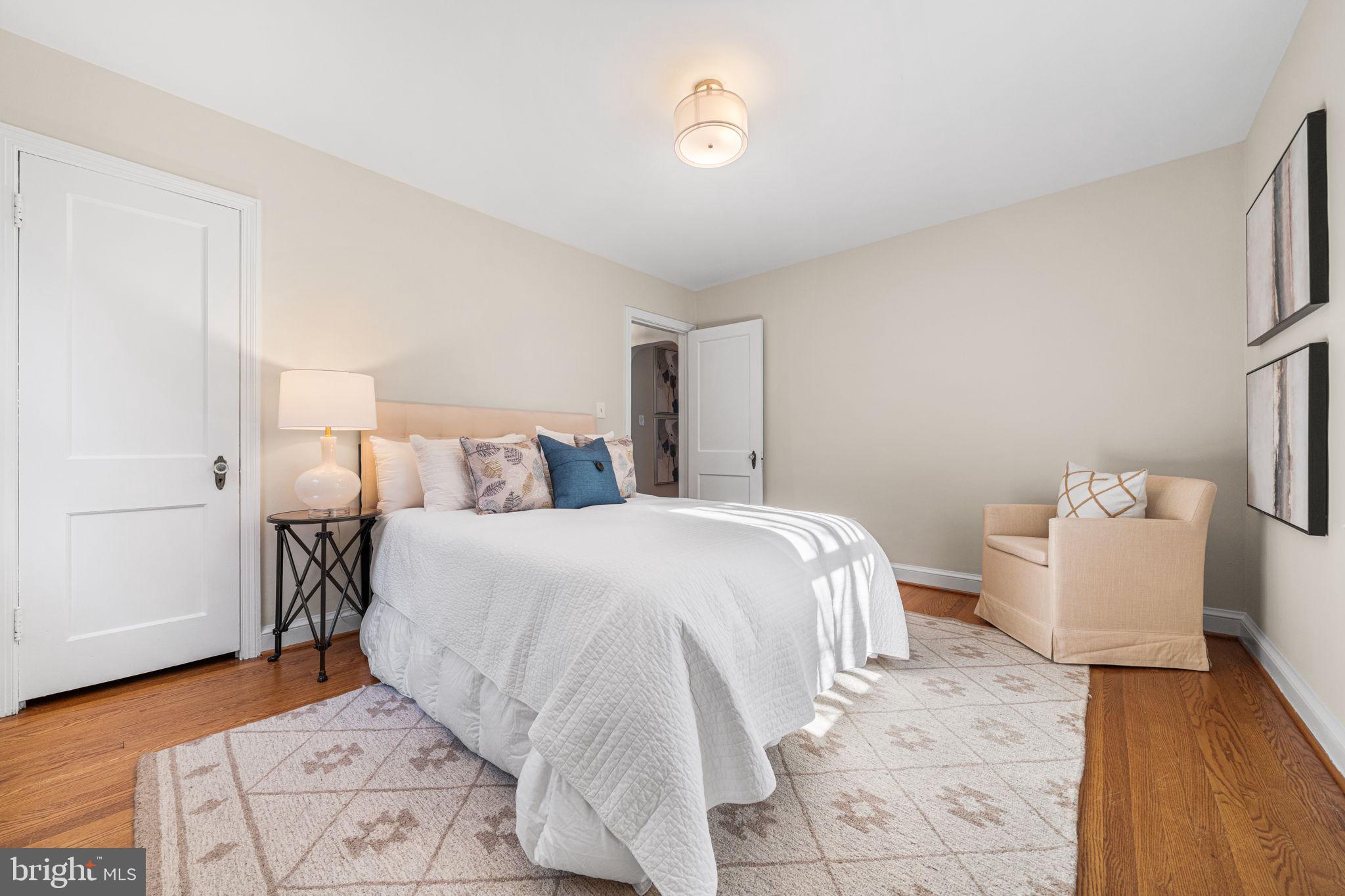 4613 8th Road South Arlington, VA 22204 - Photo 26 of 59 a bedroom with a bed and wooden floor