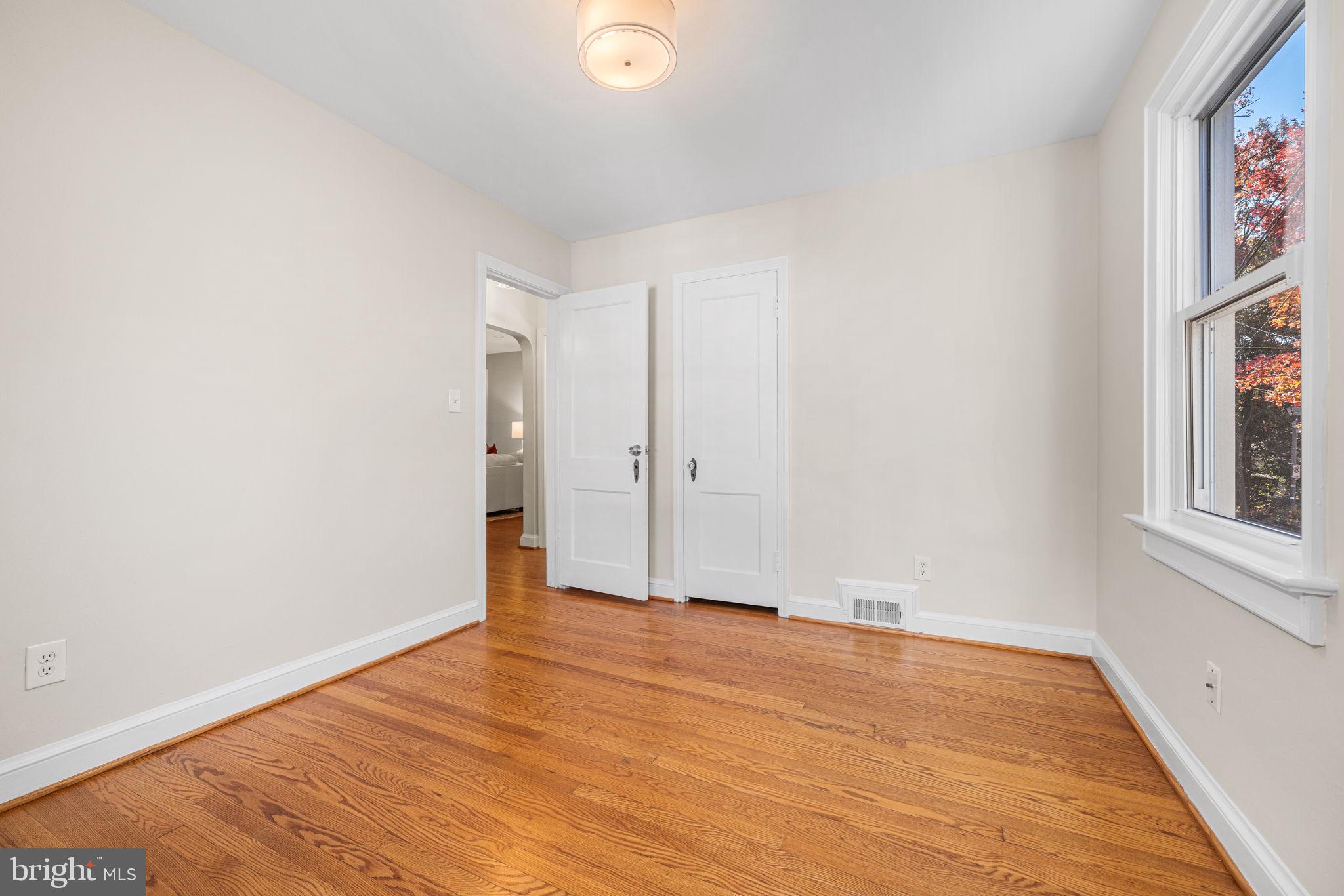 4613 8th Road South Arlington, VA 22204 - Photo 30 of 59 an empty room with wooden floor and windows