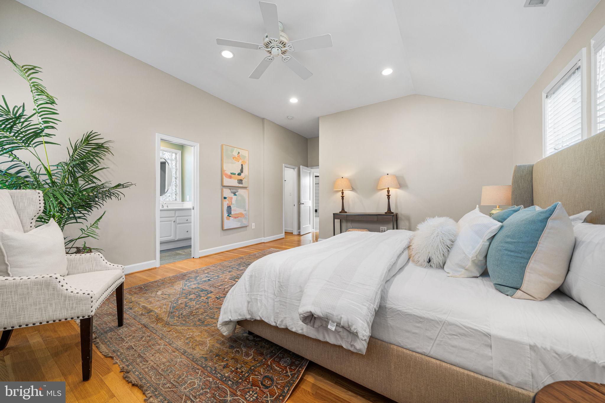4613 8th Road South Arlington, VA 22204 - Photo 41 of 59 a bedroom with a large bed chandelier and a window