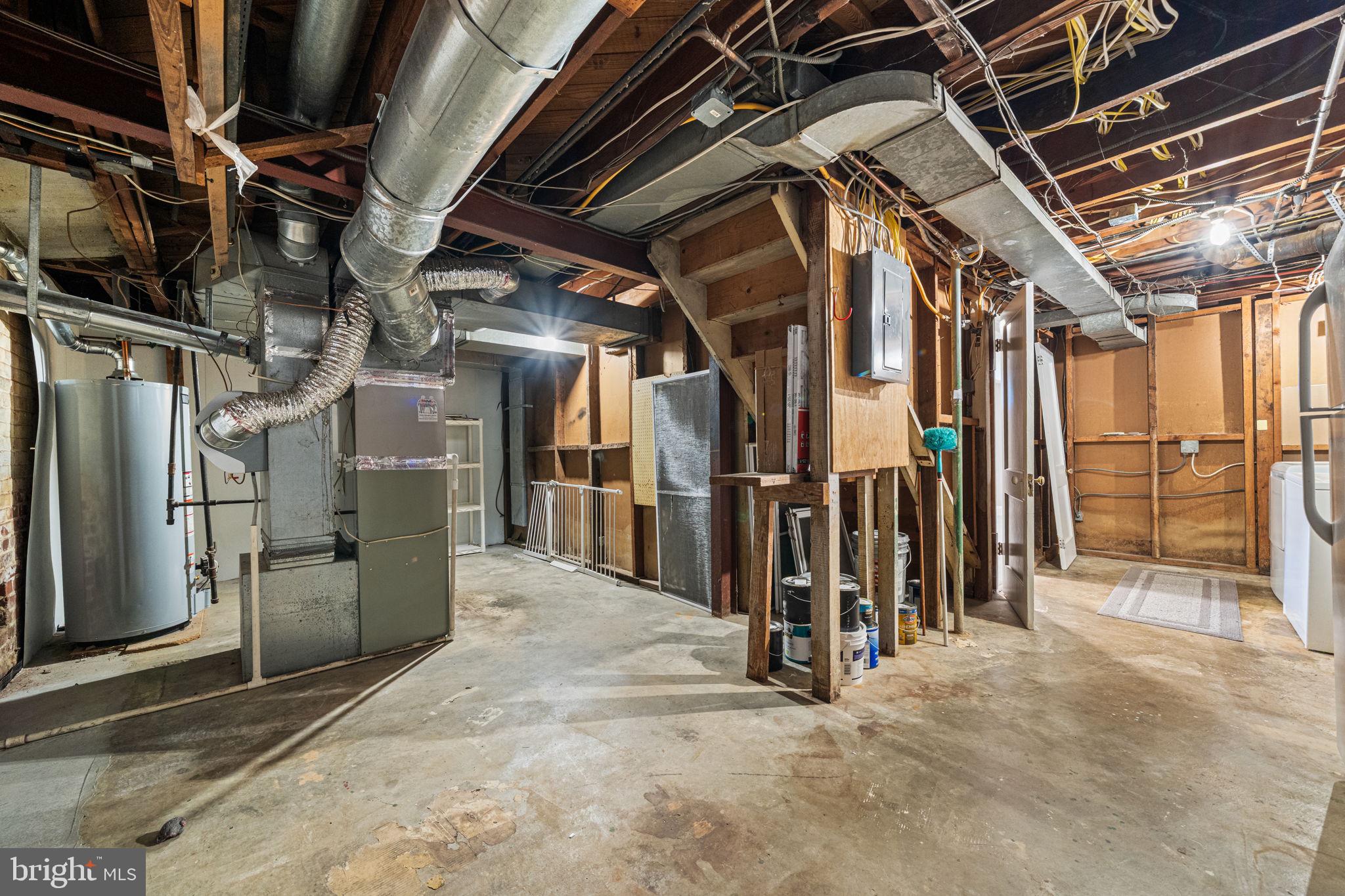 4613 8th Road South Arlington, VA 22204 - Photo 52 of 59 a view of water heater room with refrigerator