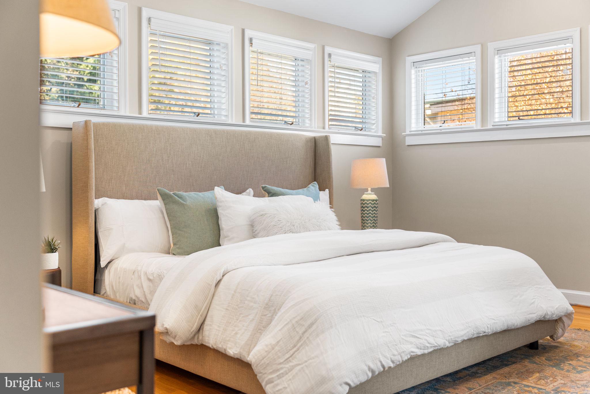 4613 8th Road South Arlington, VA 22204 - Photo 7 of 59 a large white bed in a room next to a window