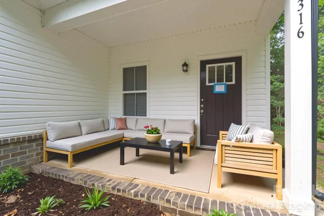 a outdoor living space with furniture and a potted plant