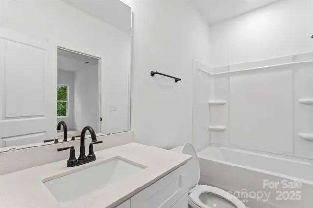a bathroom with a sink a toilet and a bathtub