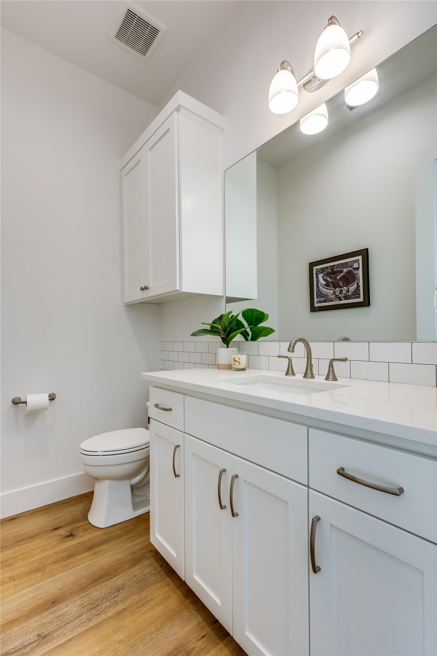 233 Lakefront Drive Lago Vista, TX 78645 - Photo 14 of 40 a bathroom with a toilet sink and mirror