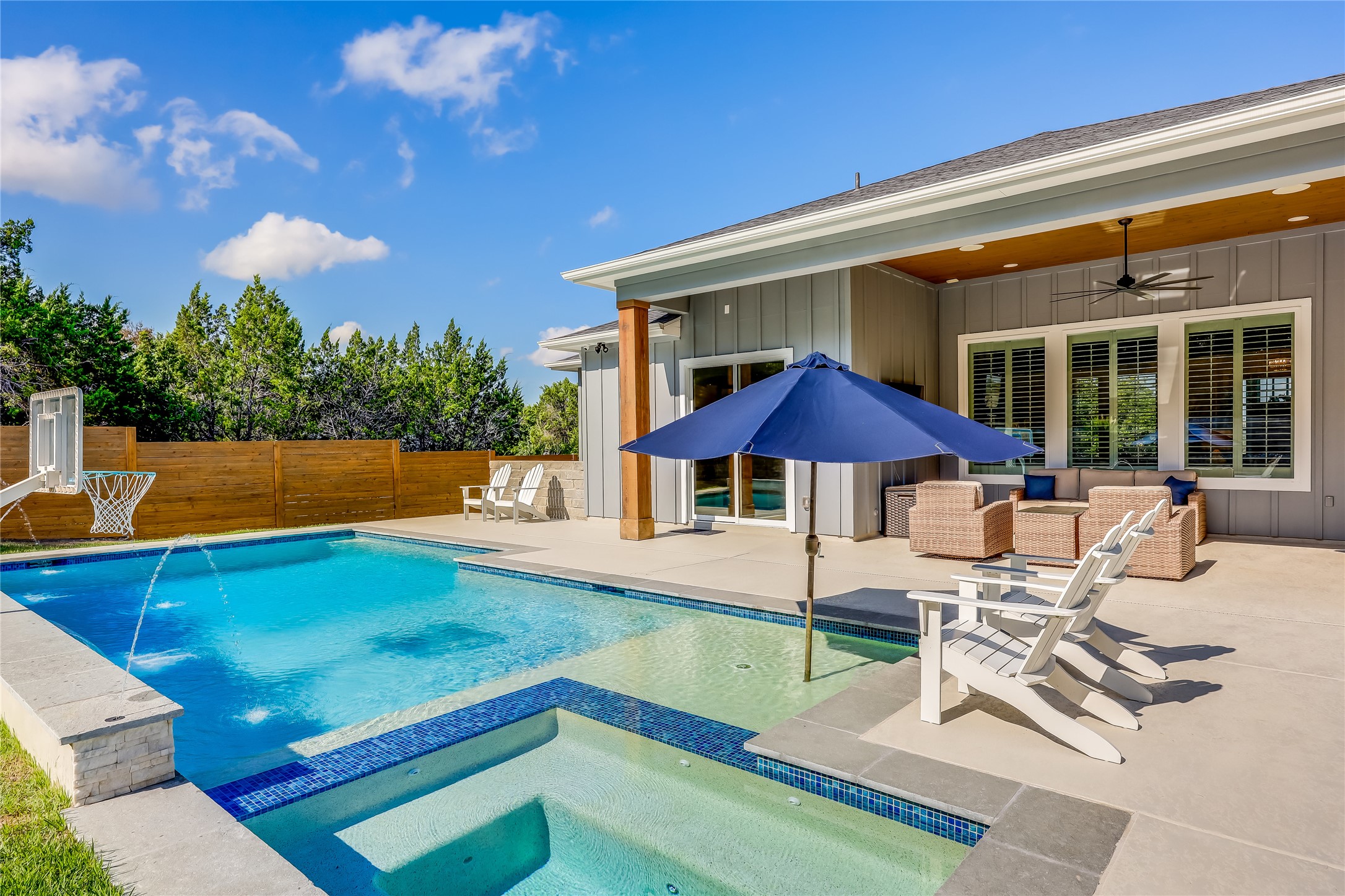 233 Lakefront Drive Lago Vista, TX 78645 - Photo 15 of 40 a view of a house with swimming pool and sitting area