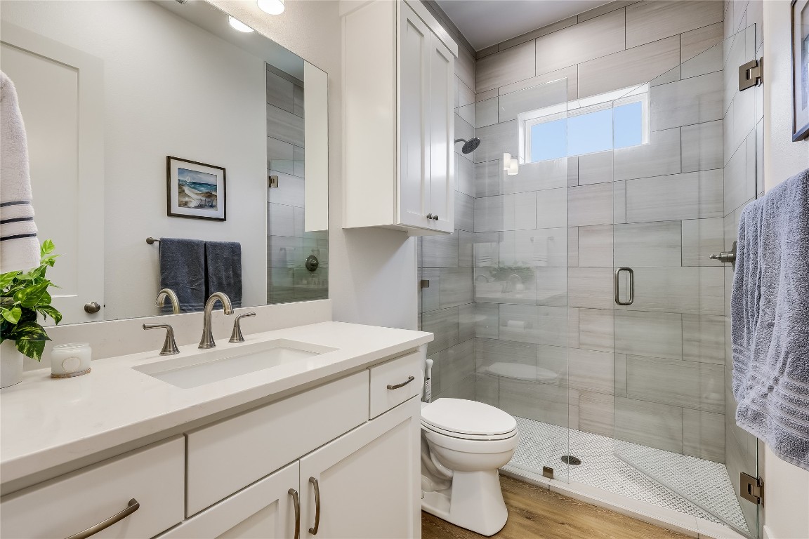 Undisclosed Address Point Venture, TX 78645 - Photo 24 of 40 a bathroom with a sink a toilet and shower