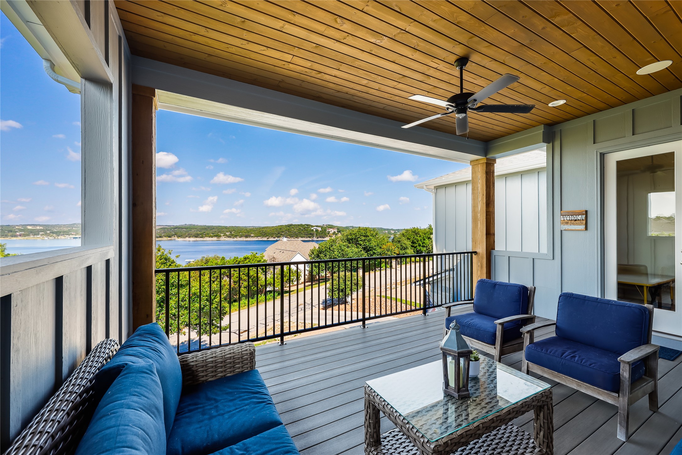 233 Lakefront Drive Lago Vista, TX 78645 - Photo 28 of 40 Deck with outdoor lounge area, ceiling fan, and a water view