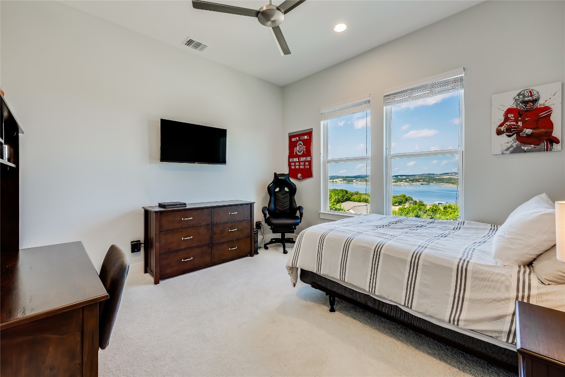 Undisclosed Address Point Venture, TX 78645 - Photo 31 of 40 a bed room with a bed window and a flat screen tv