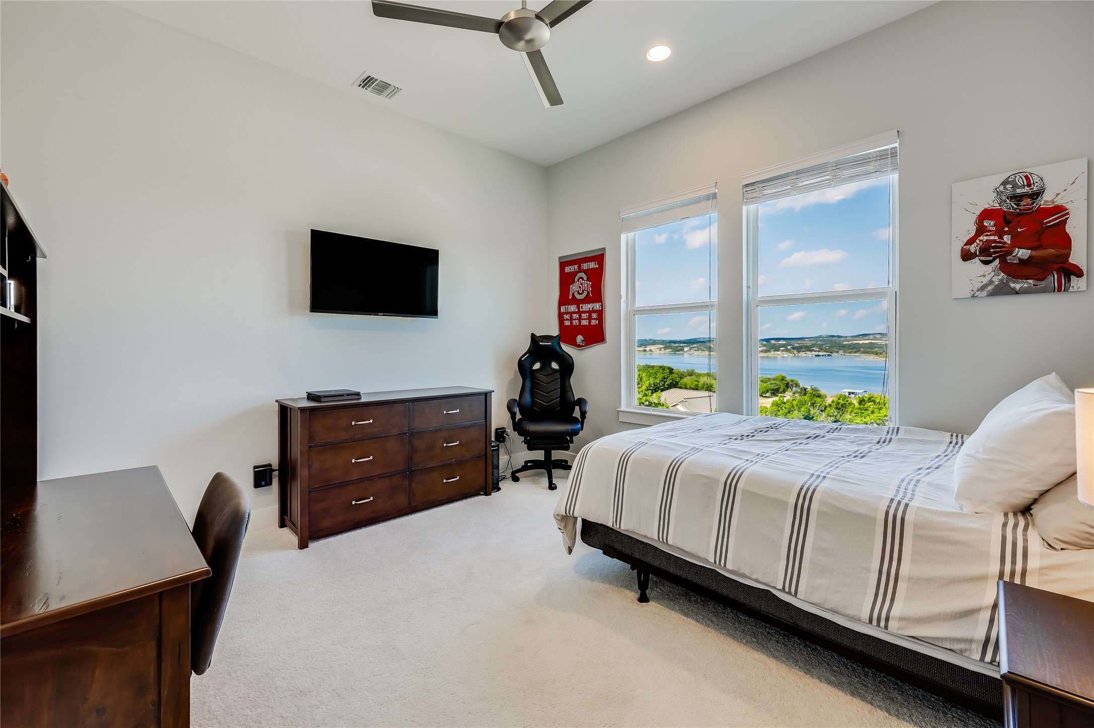 233 Lakefront Drive Lago Vista, TX 78645 - Photo 31 of 40 a bed room with a bed window and a flat screen tv