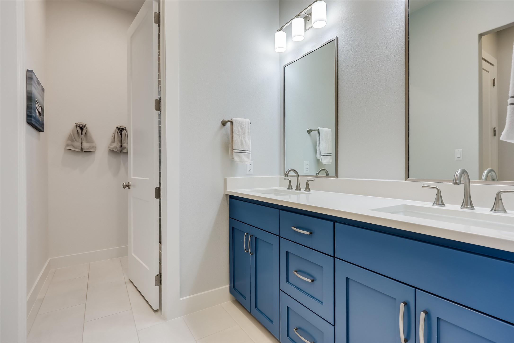 233 Lakefront Drive Lago Vista, TX 78645 - Photo 32 of 40 a bathroom with a double vanity sink and mirror