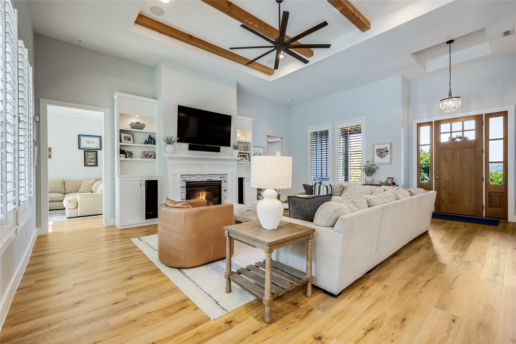 233 Lakefront Drive Lago Vista, TX 78645 - Photo 7 of 40 a living room with furniture a flat screen tv and a fireplace