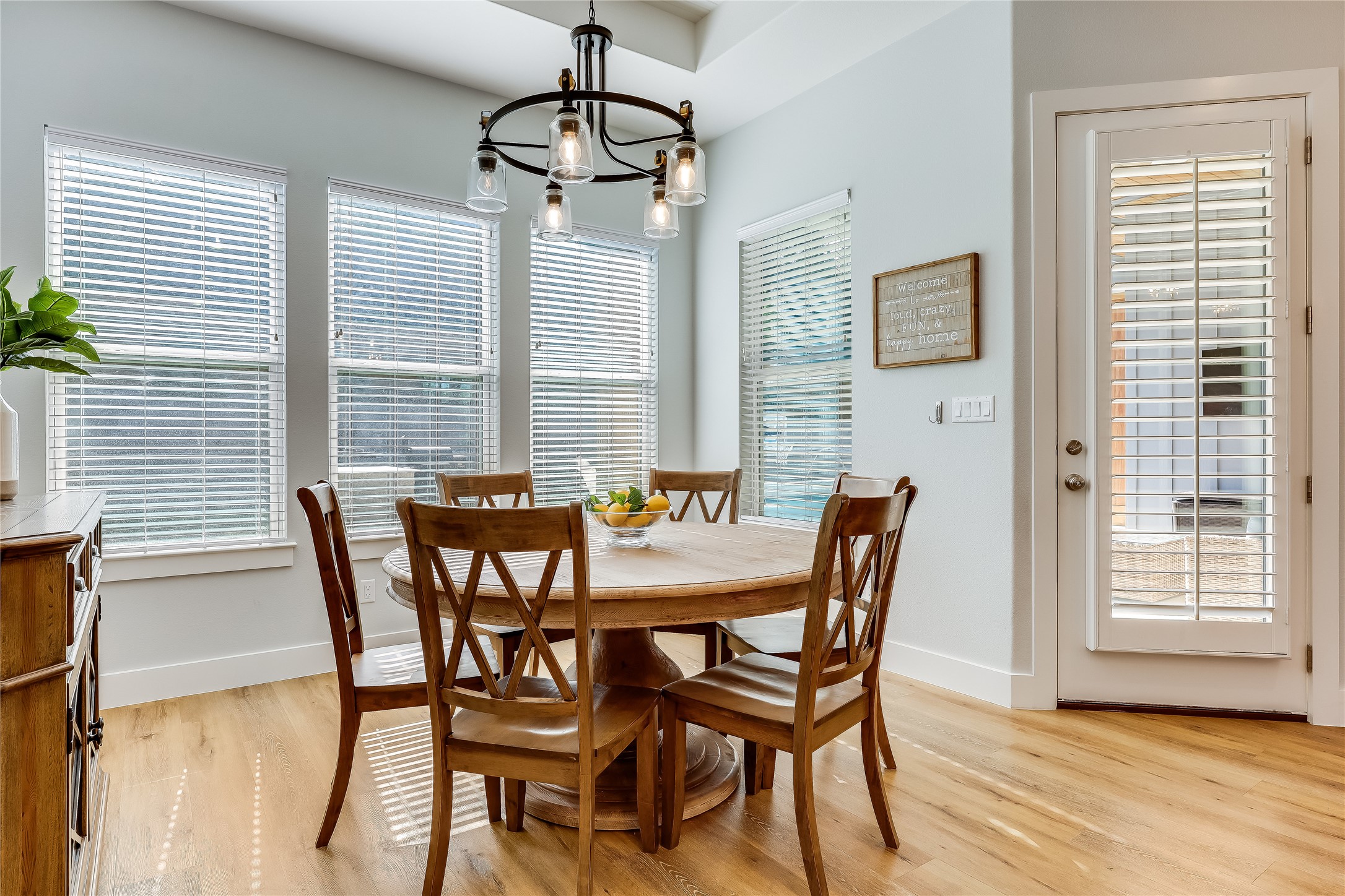 233 Lakefront Drive Lago Vista, TX 78645 - Photo 10 of 40 a view of a dining room with furniture and wooden floor