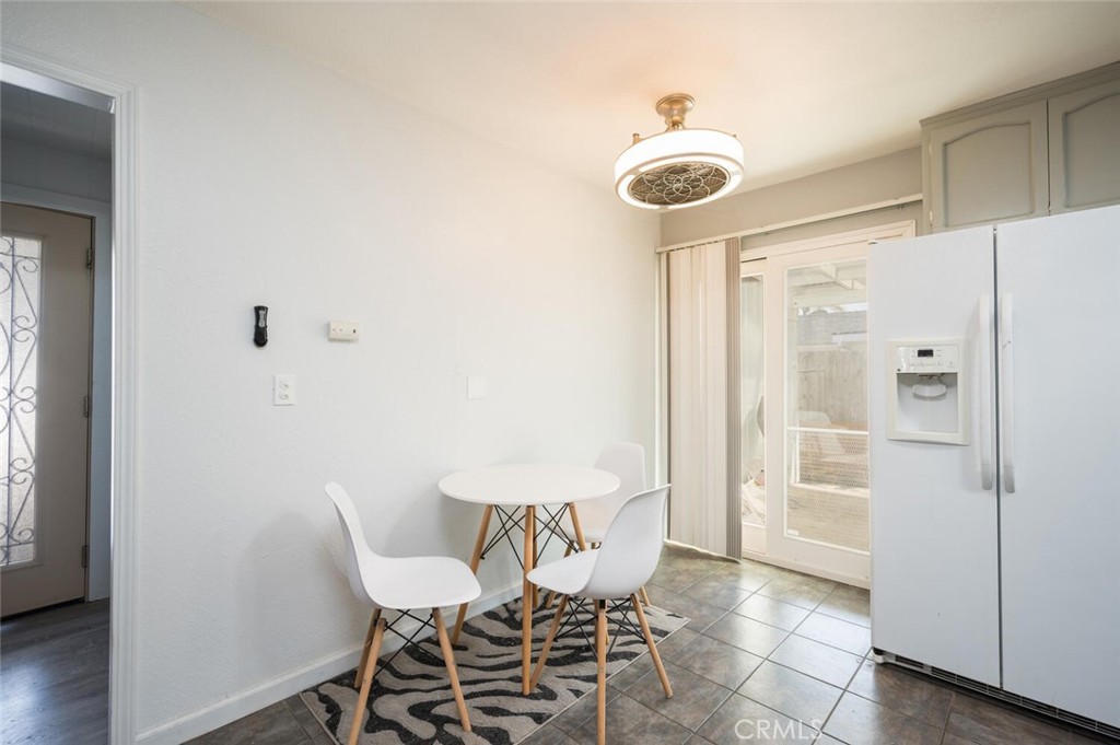 1503 17th Street Los Osos, CA 93402 - Photo 13 of 35 a view of a dining room with furniture and wooden floor