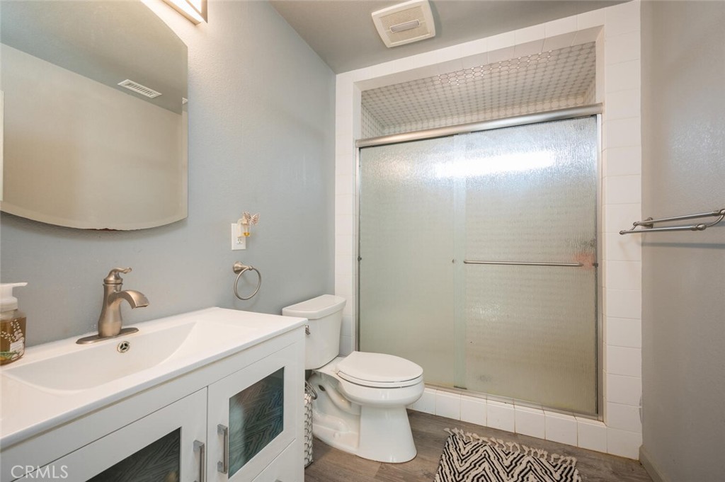 1503 17th Street Los Osos, CA 93402 - Photo 21 of 35 a bathroom with a sink a toilet and shower