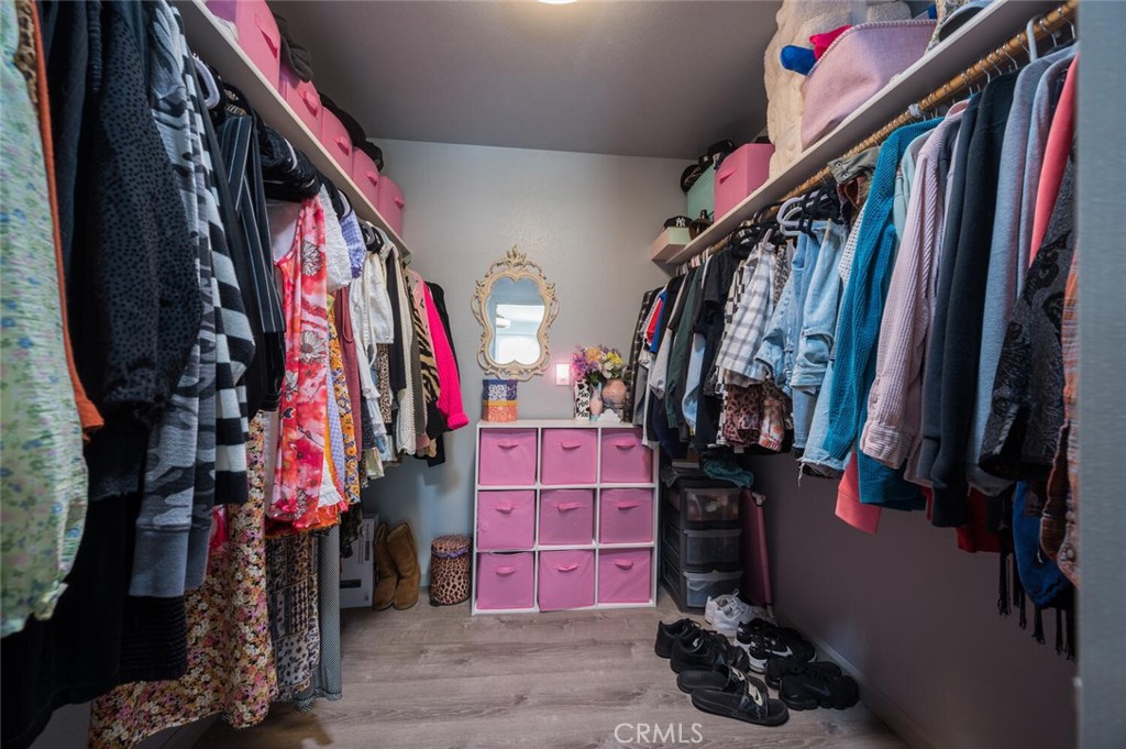 1503 17th Street Los Osos, CA 93402 - Photo 22 of 35 a view of walk in closet with clothes