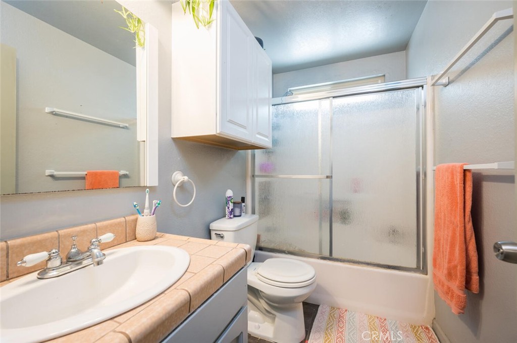 1503 17th Street Los Osos, CA 93402 - Photo 27 of 35 a bathroom with a sink toilet and shower