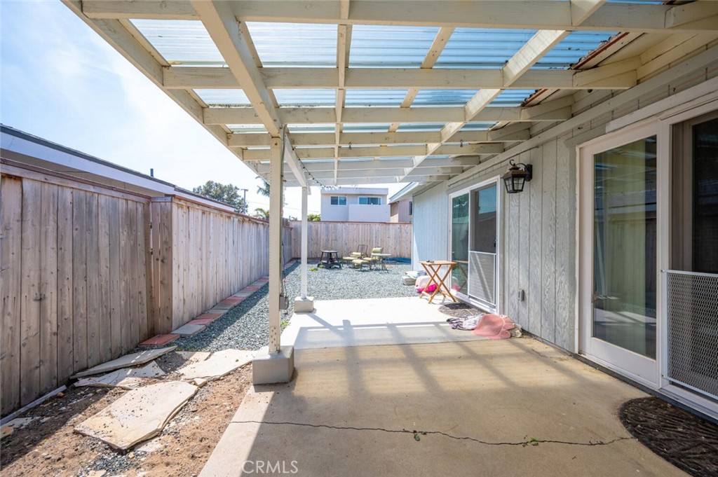 1503 17th Street Los Osos, CA 93402 - Photo 32 of 35 a view of a patio with table and chairs and potted plants