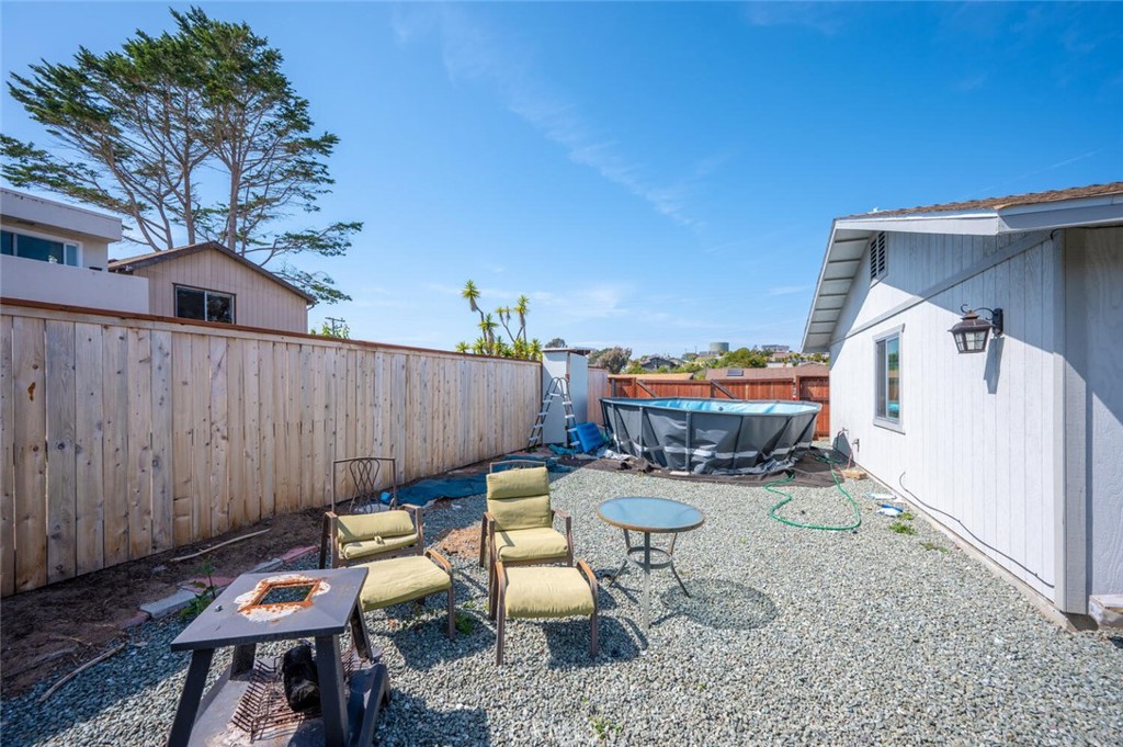 1503 17th Street Los Osos, CA 93402 - Photo 34 of 35 a backyard of a house with table and chairs