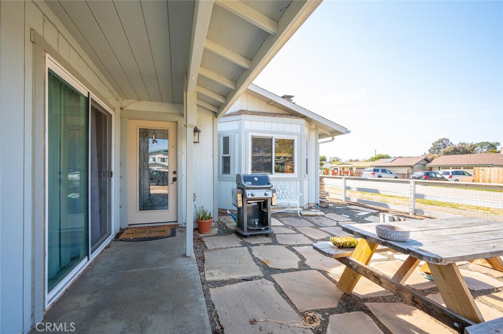 1503 17th Street Los Osos, CA 93402 - Photo 5 of 35 a view of a patio with swimming pool table and chairs
