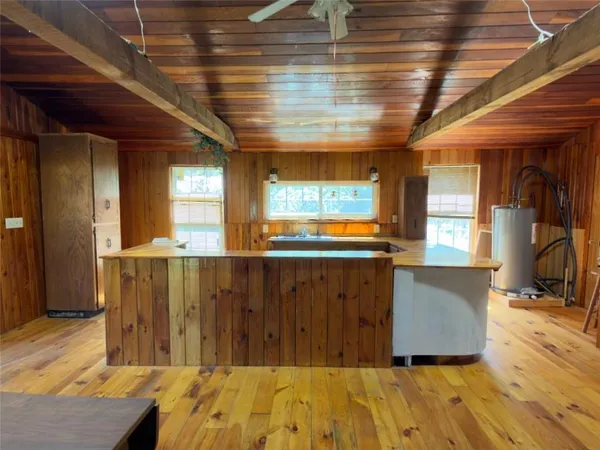 a view of a kitchen with furniture and a window