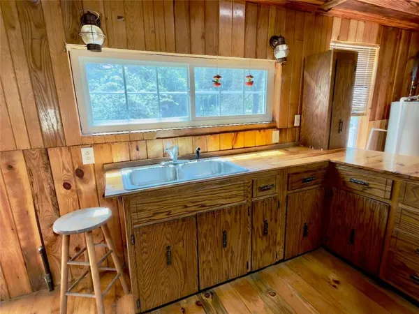 a bathroom with sink mirror and
