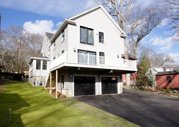 358 Marrett Road Lexington, MA 02421 - Photo 2 of 12 a front view of a house with a yard