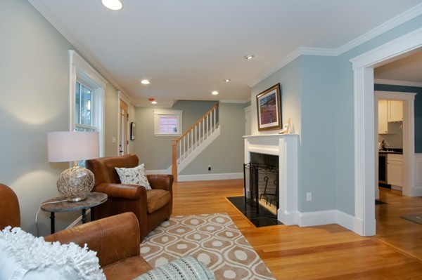 358 Marrett Road Lexington, MA 02421 - Photo 3 of 12 a living room with furniture and a fireplace