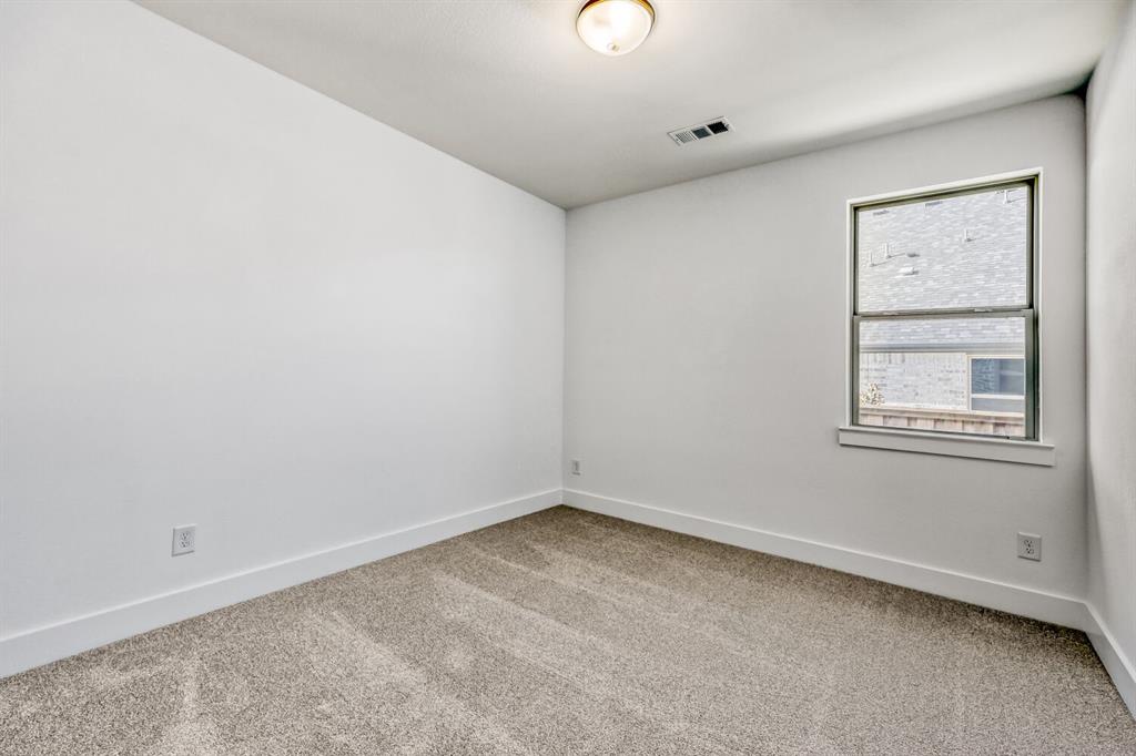 147 Derrett Lane Rhome, TX 76078 - Photo 8 of 28 Unfurnished room with light carpet and baseboards