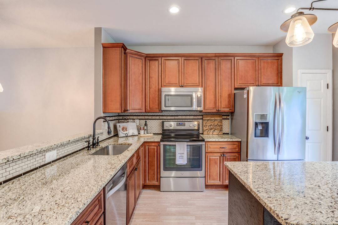 4936 Wyatt Brook Way Raleigh, NC 27609 - Photo 4 of 27 Granite, updated cabinets and stainless appliances! Kitchen