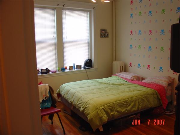 65 Lanark Road, Unit 3 Boston, MA 02135 - Photo 2 of 6 a bedroom with a bed and a window