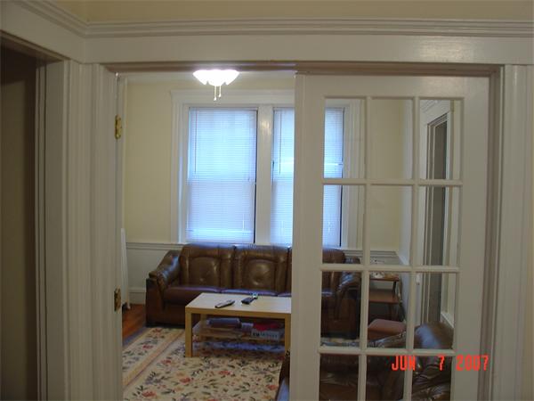 65 Lanark Road, Unit 3 Boston, MA 02135 - Photo 5 of 6 a bathroom with a bathtub and a window