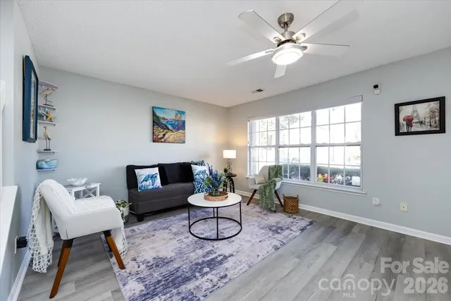 a living room with furniture and window