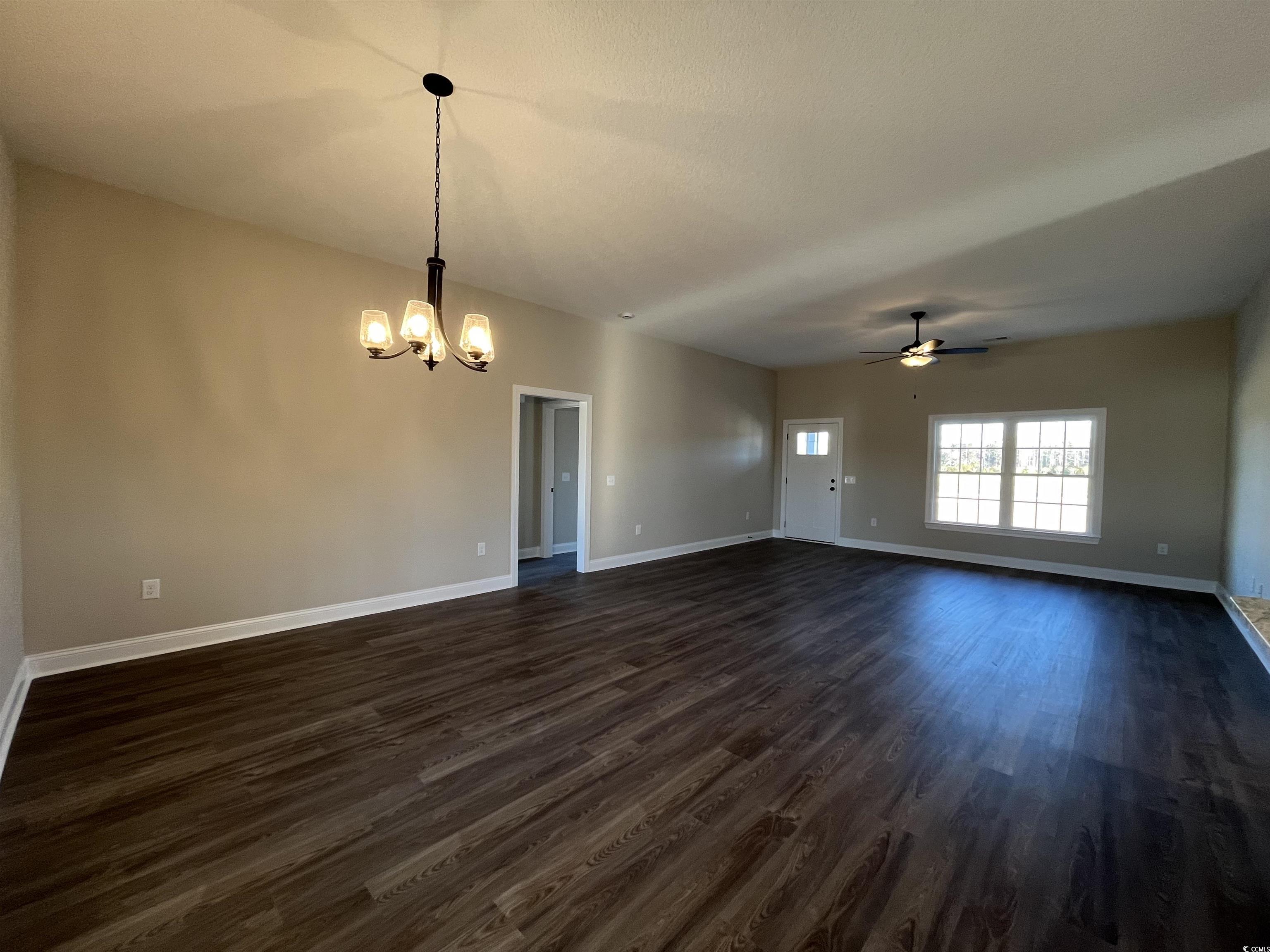 8201 Kerl Road Aynor, SC 29511 - Photo 2 of 20 Spare room with dark hardwood / wood-style floors