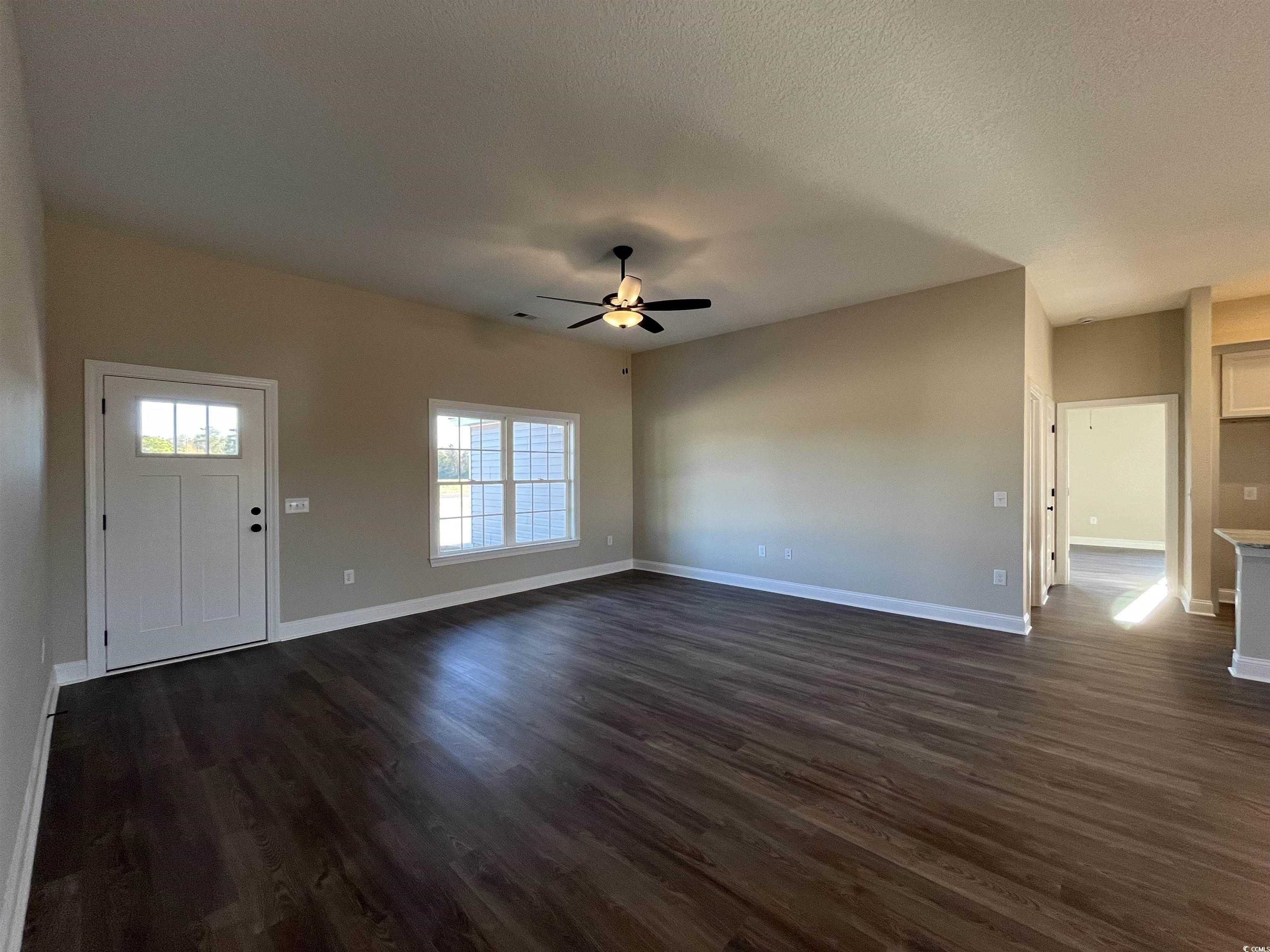 8201 Kerl Road Aynor, SC 29511 - Photo 3 of 20 Unfurnished living room featuring a textured ceili