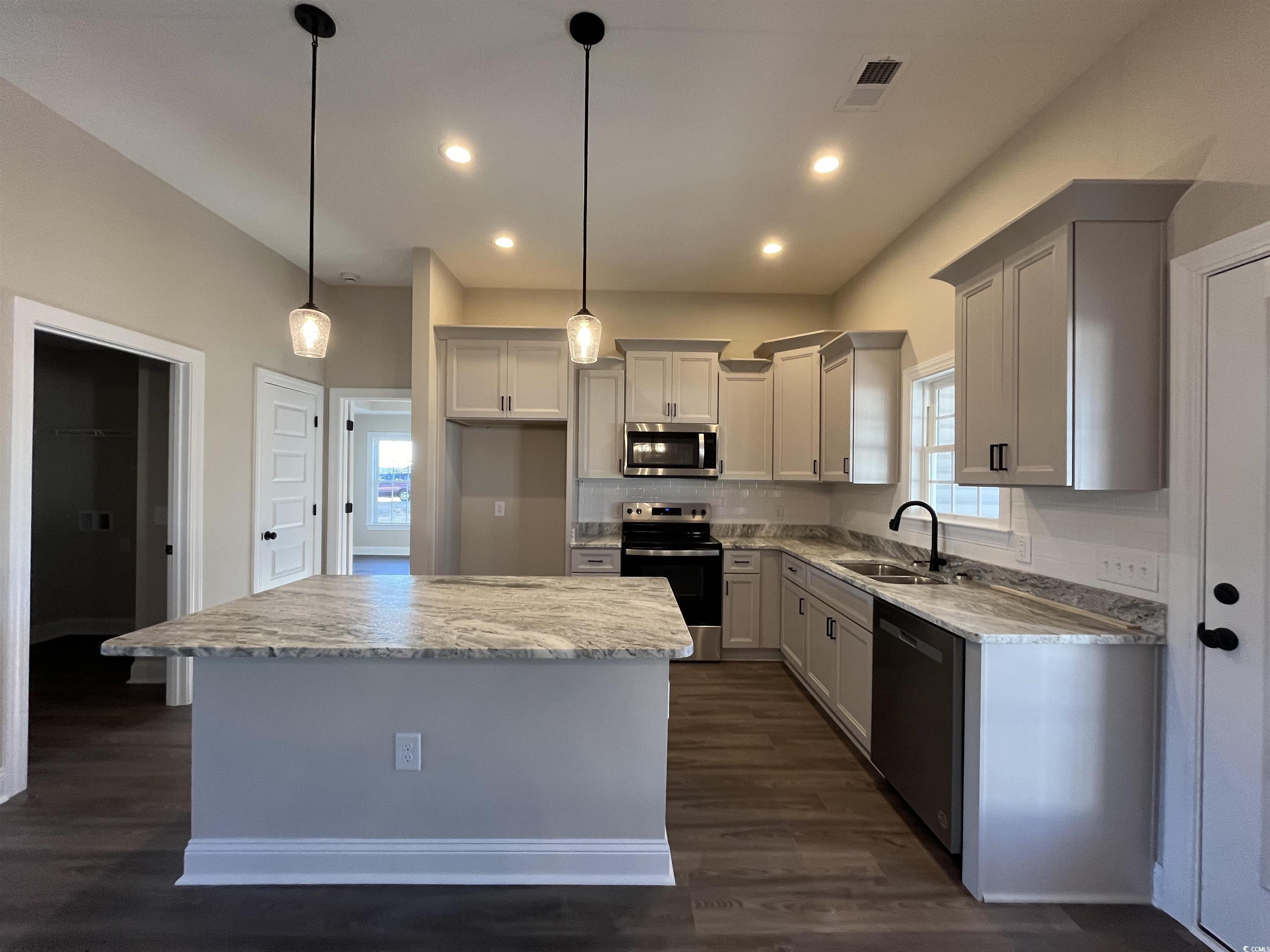 8201 Kerl Road Aynor, SC 29511 - Photo 7 of 20 Kitchen featuring light stone countertops, applian