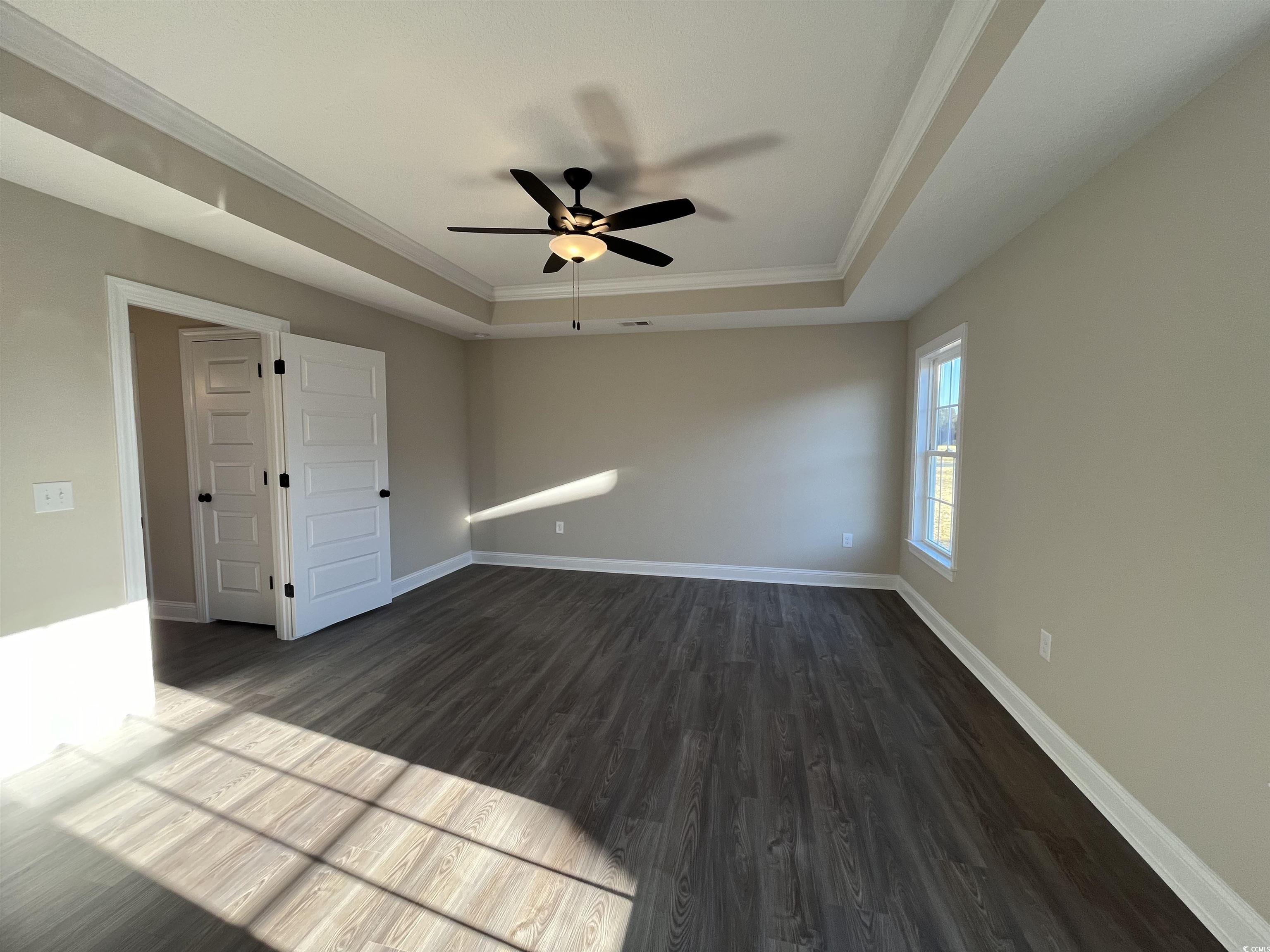 8201 Kerl Road Aynor, SC 29511 - Photo 9 of 20 Empty room featuring ceiling fan, dark hardwood /