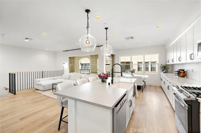 a kitchen with stove and cabinets
