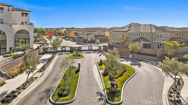 an aerial view of residential houses with city view